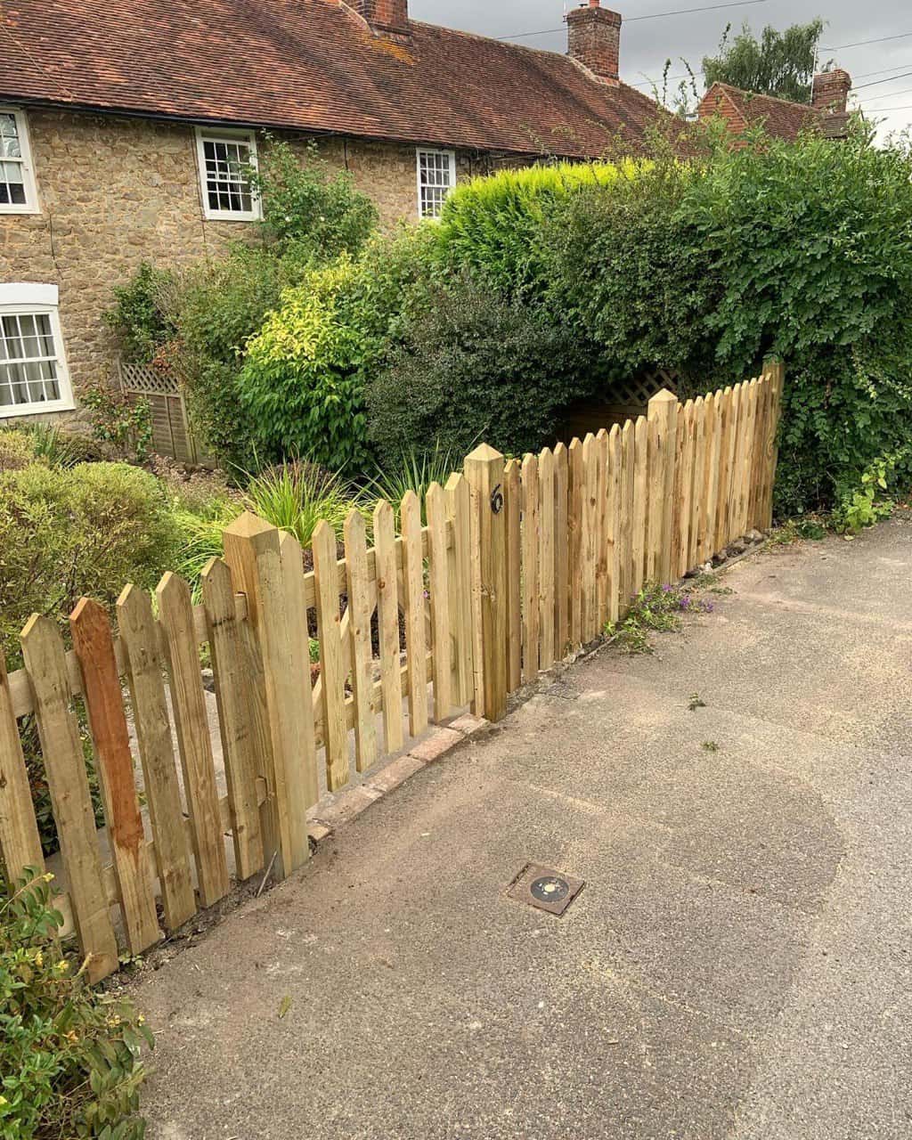 This is a photo of a picket fence and picket gate installed by Fast Fix Fencing Soham