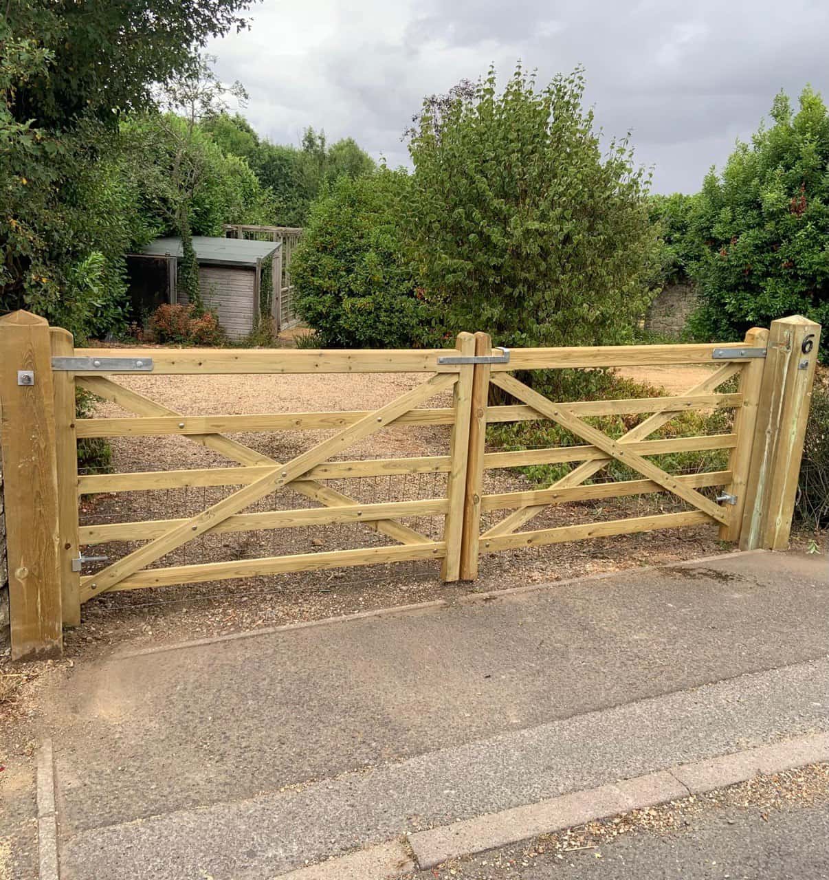 This is a photo of a wooden driveway gate installed by Fast Fix Fencing Soham